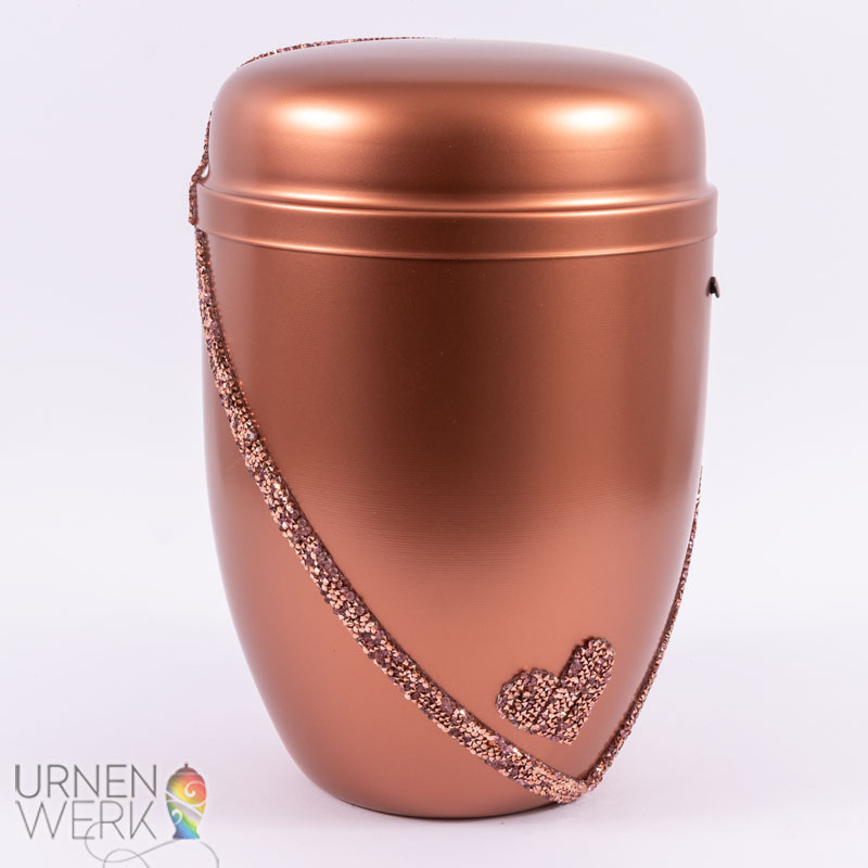 Metall Urne kupferfarben- Herzensband - unendliche Seelenliebe-F Frontansicht der kupfrig schimmernden Designurne Herzensband - Frontansicht des unendlichen glitzernden Bandes inkl. Herz